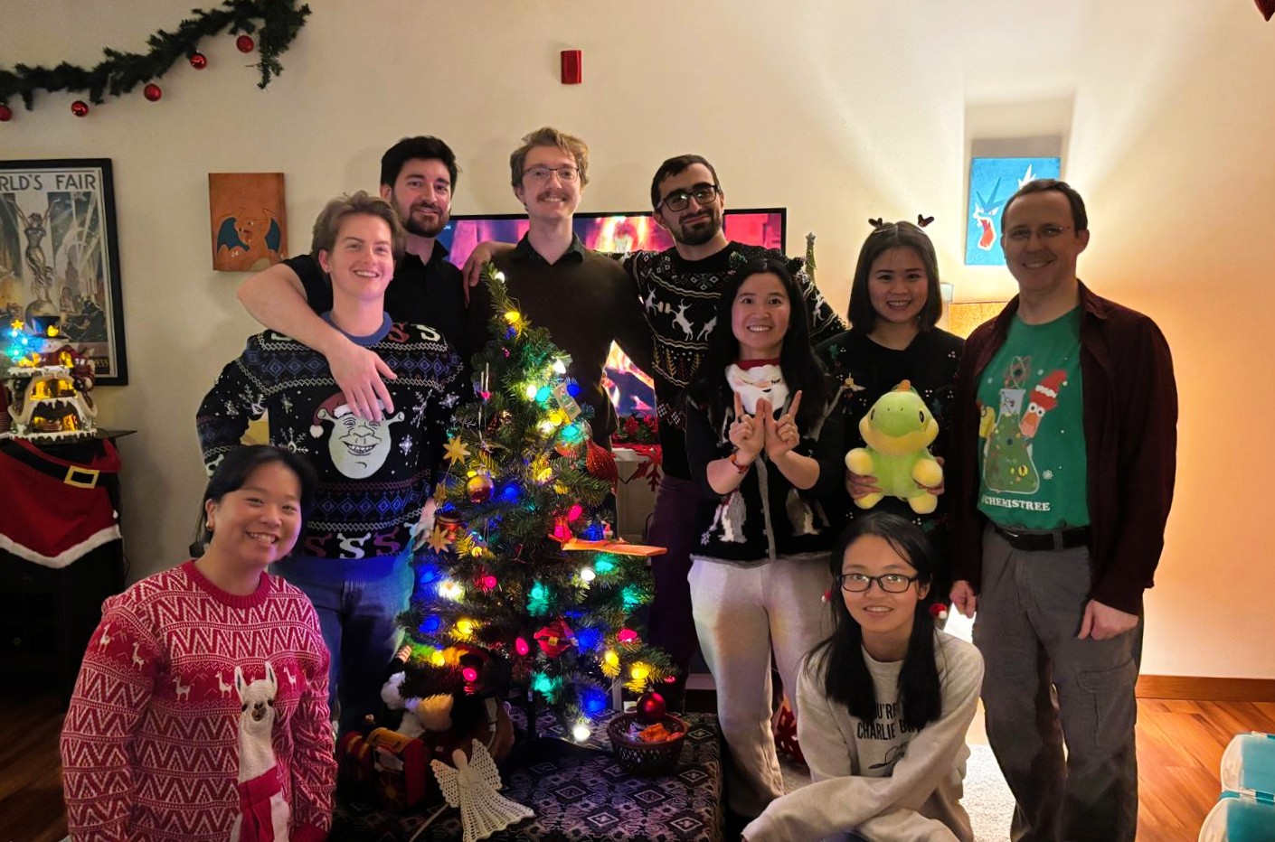 members participating in badminton, arm wrestling, campfire and more at Mike's house